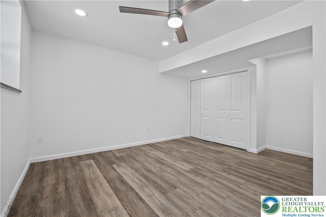 1111 Delabole Jct Road Pen Argyl, PA 18072 - Photo 24 of 26 wooden floor in an empty room with a window