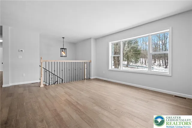 a kitchen with stainless steel appliances and white cabinets