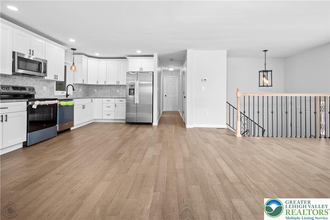 1111 Delabole Jct Road Pen Argyl, PA 18072 - Photo 10 of 26 a kitchen with stainless steel appliances a refrigerator and a stove top oven