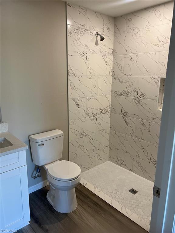 374 Compese Avenue South Lehigh Acres, FL 33974 - Photo 3 of 15 a bathroom with a toilet and a shower