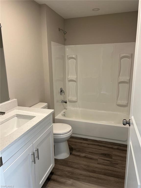 374 Compese Avenue South Lehigh Acres, FL 33974 - Photo 8 of 15 a bathroom with a sink a toilet and bathtub