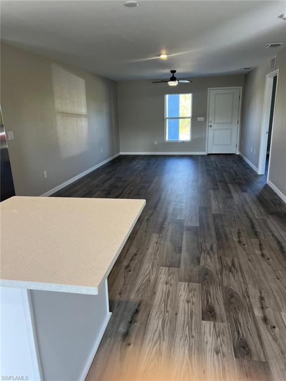374 Compese Avenue South Lehigh Acres, FL 33974 - Photo 10 of 15 wooden floor in an empty room with a window