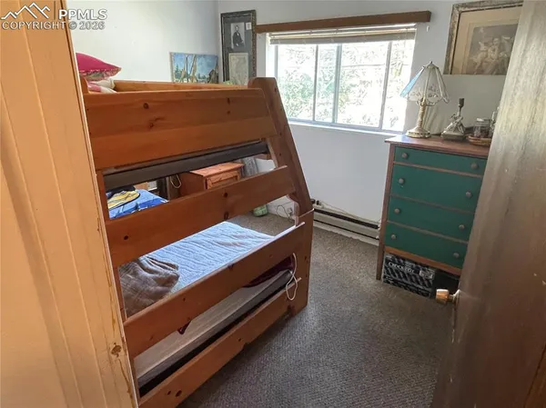 a room with washing machine and window
