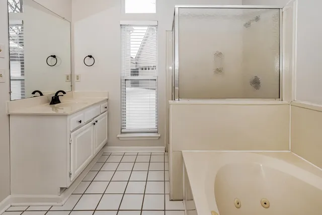 a bathroom with a bathtub and a sink