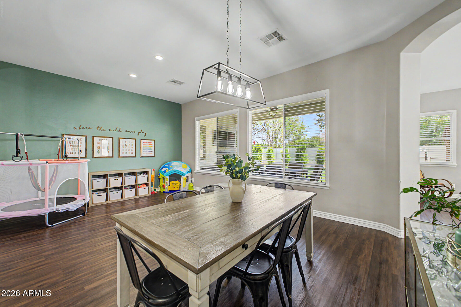 2065 South Porter Street Gilbert, AZ 85295 - Photo 11 of 36 a view of a dining room with furniture window and wooden floor