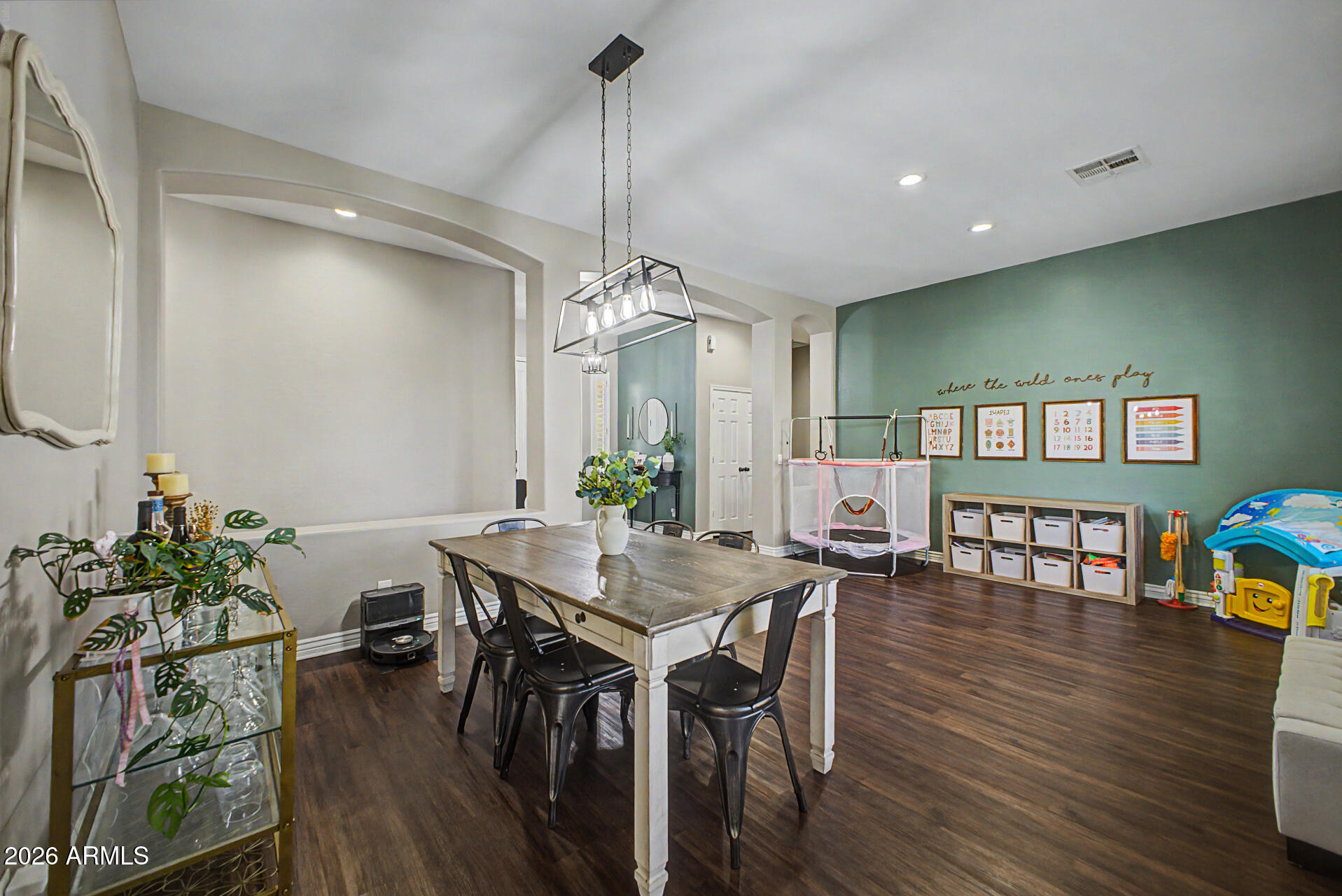 2065 South Porter Street Gilbert, AZ 85295 - Photo 12 of 36 a view of a dining room and livingroom with furniture wooden floor a chandelier