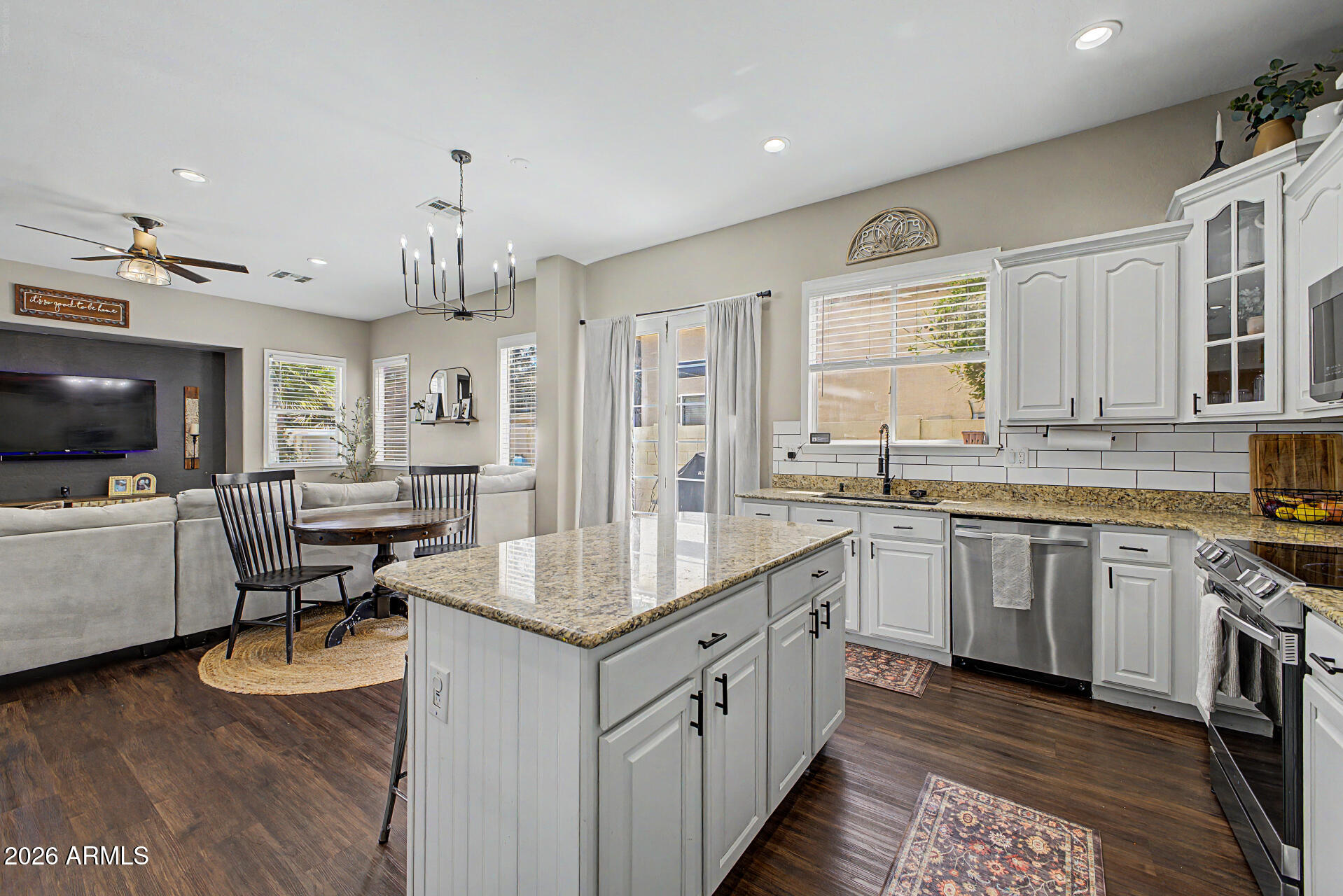 2065 South Porter Street Gilbert, AZ 85295 - Photo 17 of 36 a kitchen with sink stove and cabinets