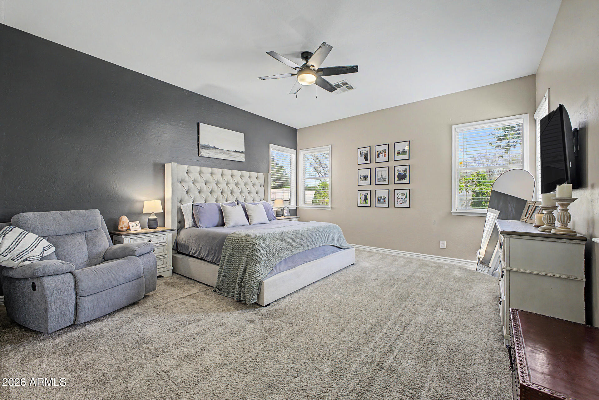 2065 South Porter Street Gilbert, AZ 85295 - Photo 18 of 36 a bedroom with a large bed and a couch