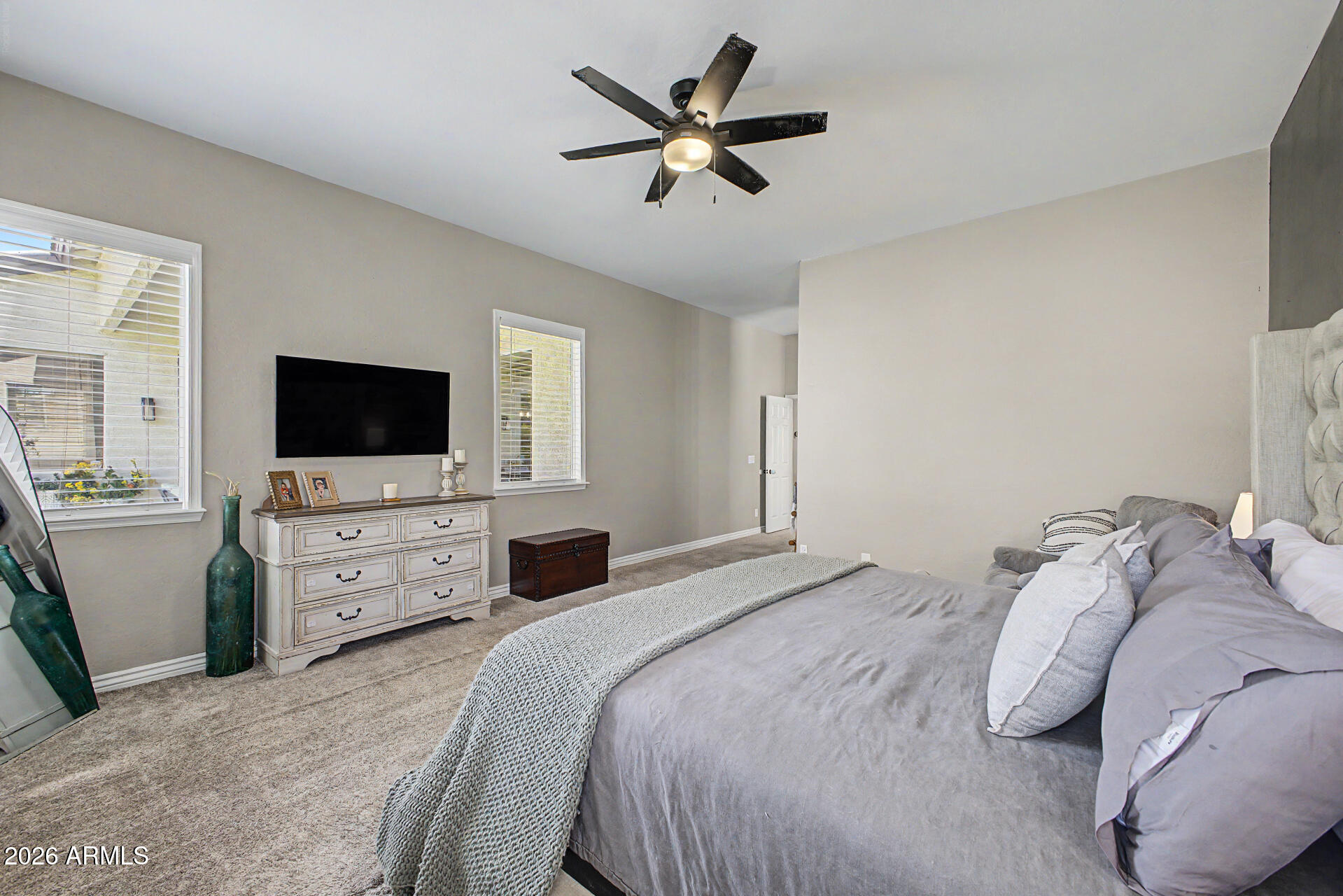 2065 South Porter Street Gilbert, AZ 85295 - Photo 20 of 36 a bedroom with a bed and a flat screen tv