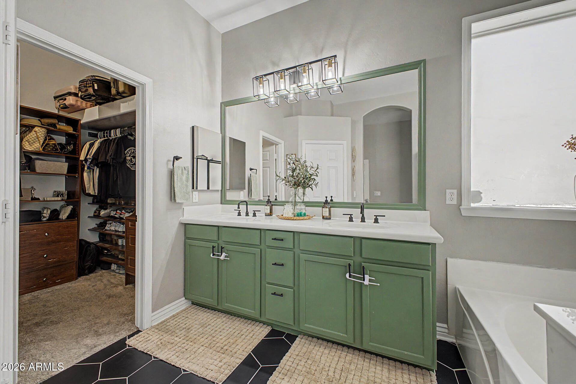 2065 South Porter Street Gilbert, AZ 85295 - Photo 21 of 36 a bathroom with a double vanity sink and a mirror
