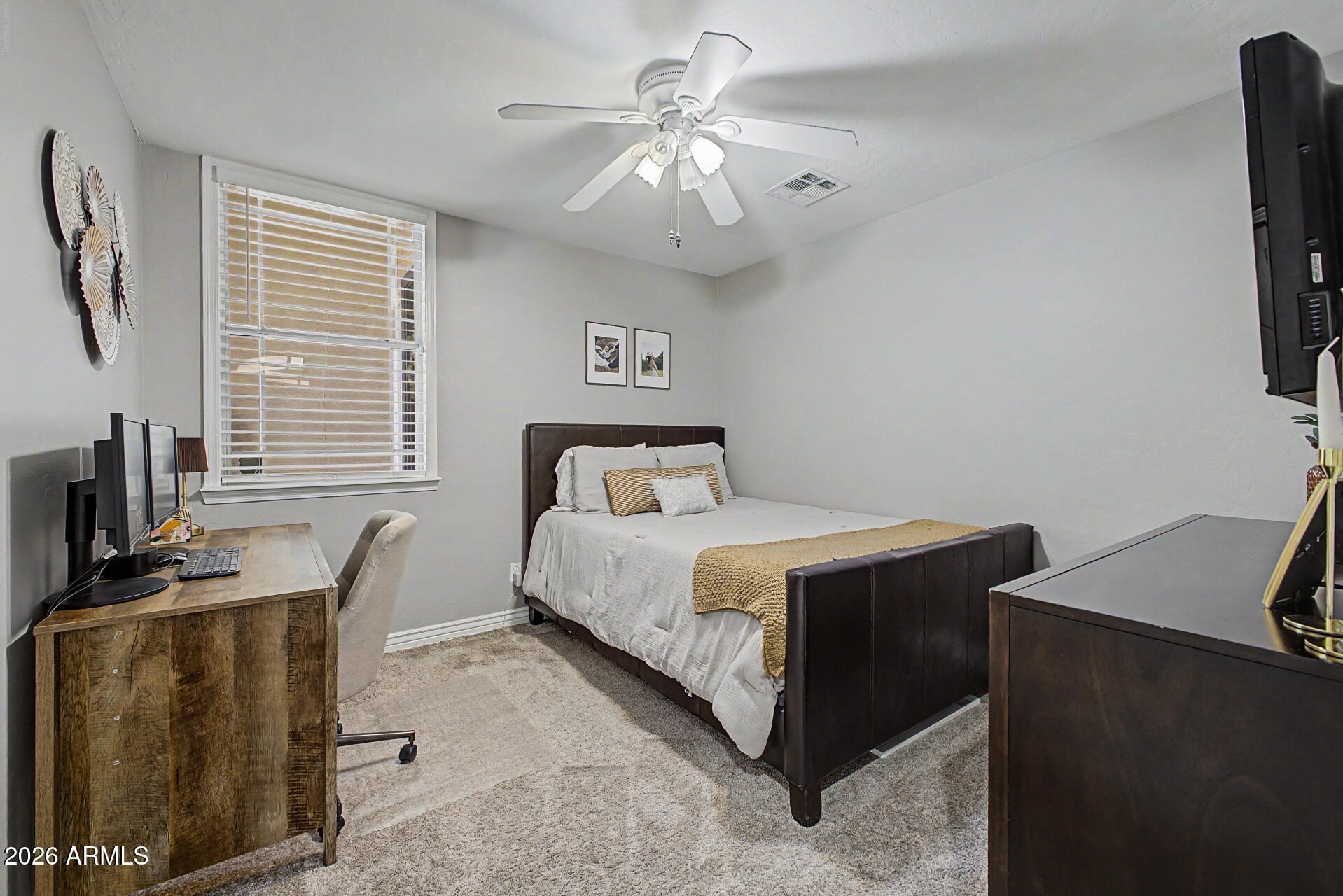 2065 South Porter Street Gilbert, AZ 85295 - Photo 24 of 36 a bedroom with a bed and a desk