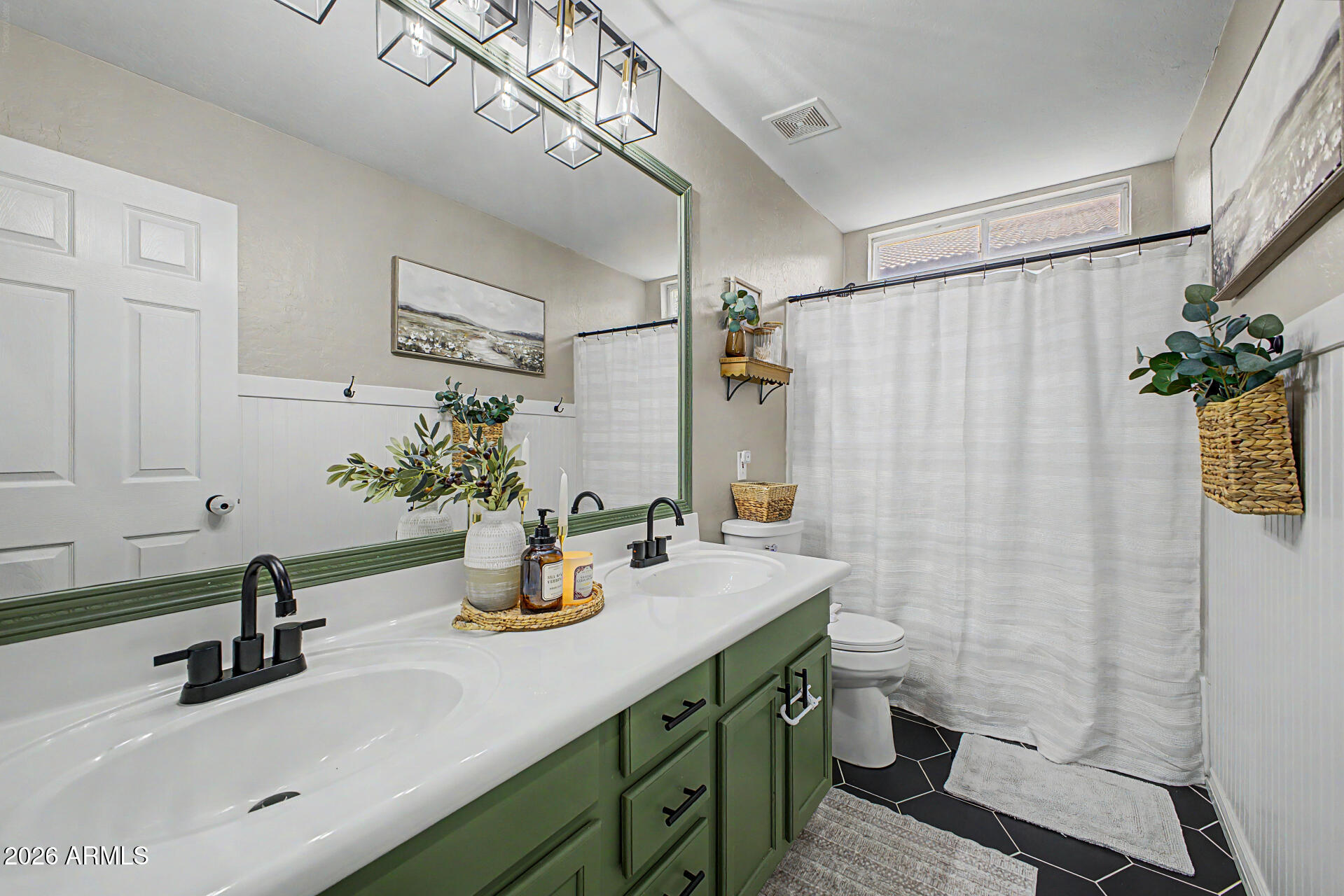 2065 South Porter Street Gilbert, AZ 85295 - Photo 25 of 36 a bathroom with a sink a mirror and a shower curtain