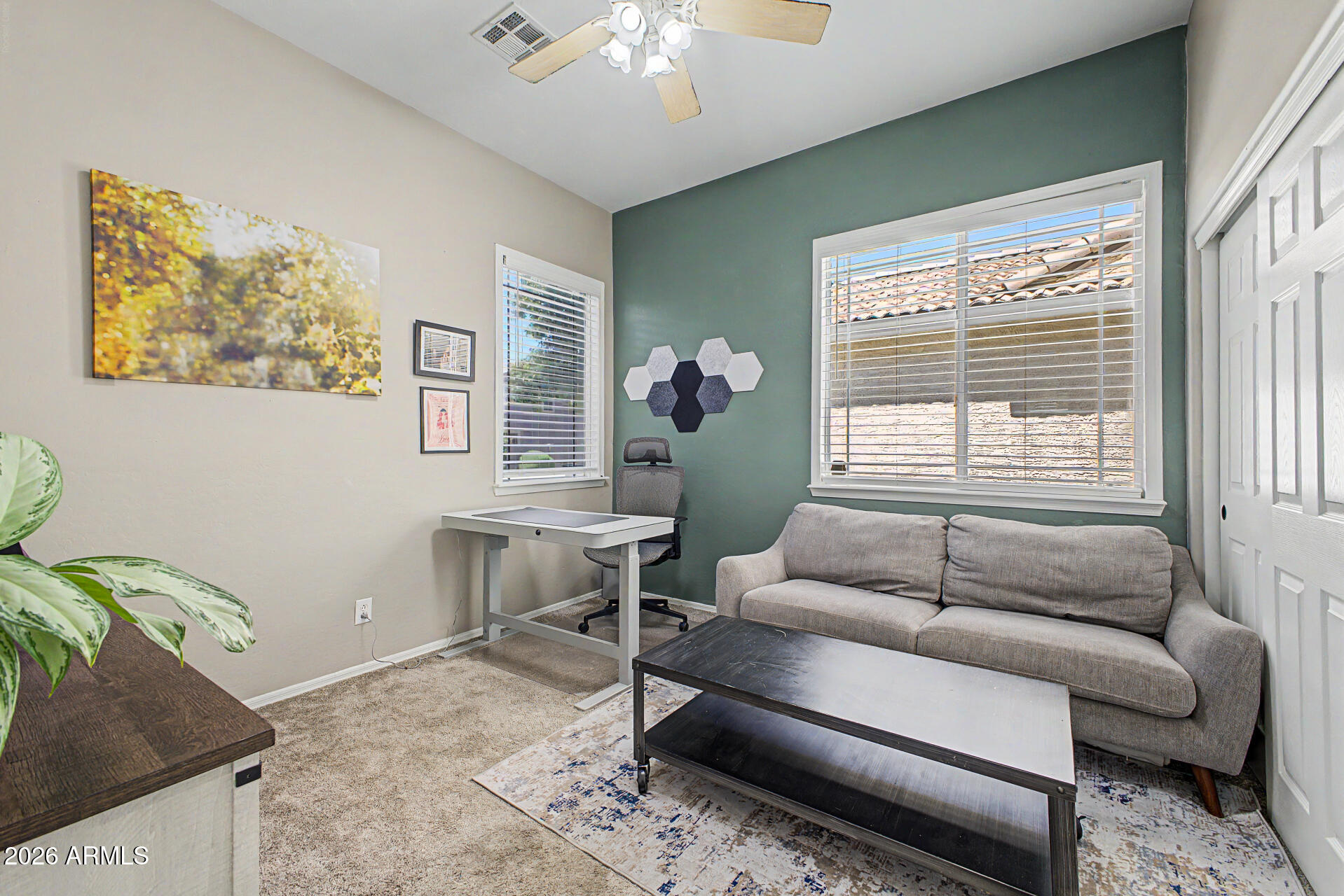 2065 South Porter Street Gilbert, AZ 85295 - Photo 27 of 36 a living room with furniture and a large window