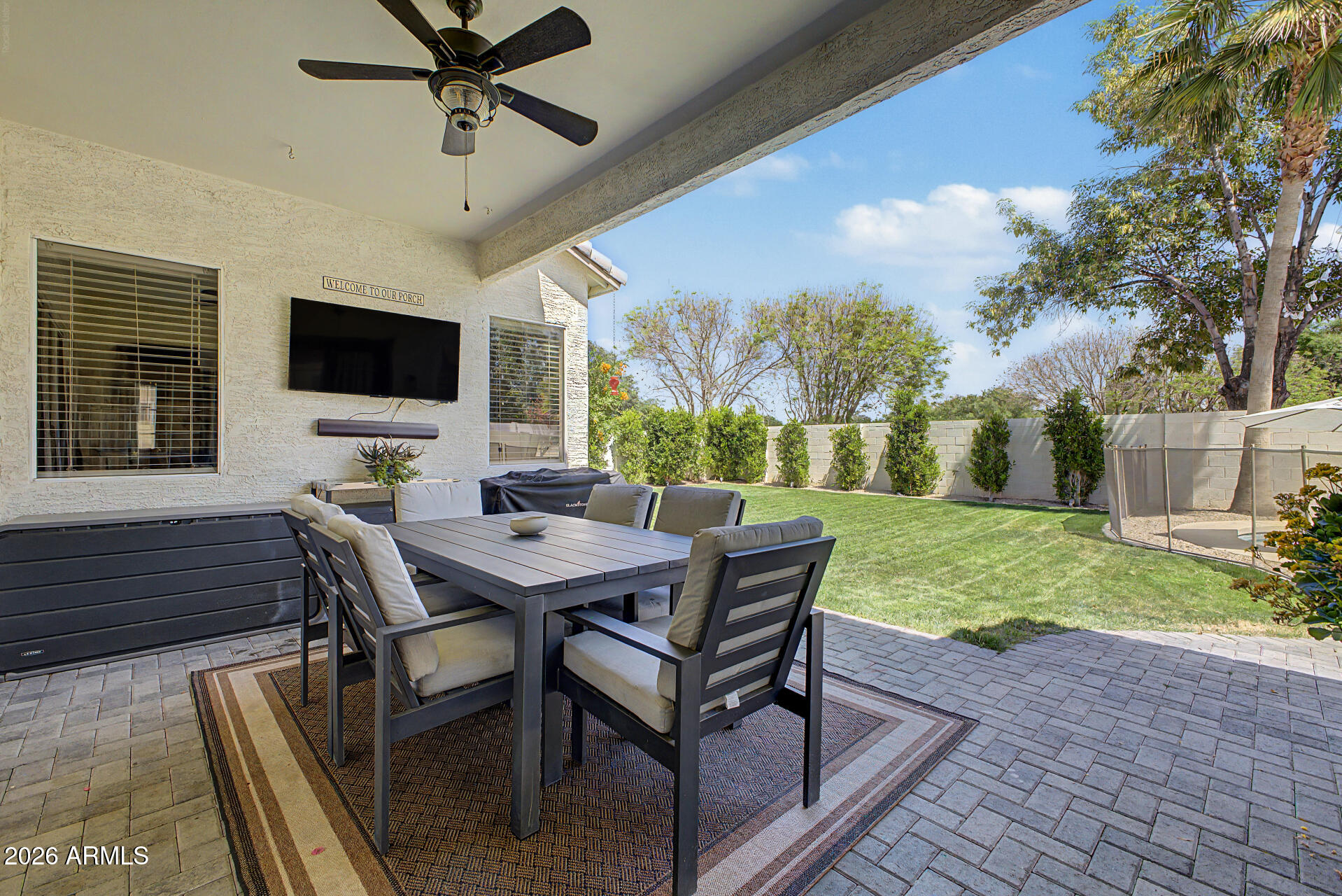 2065 South Porter Street Gilbert, AZ 85295 - Photo 31 of 36 a view of a patio with a table chairs and a backyard