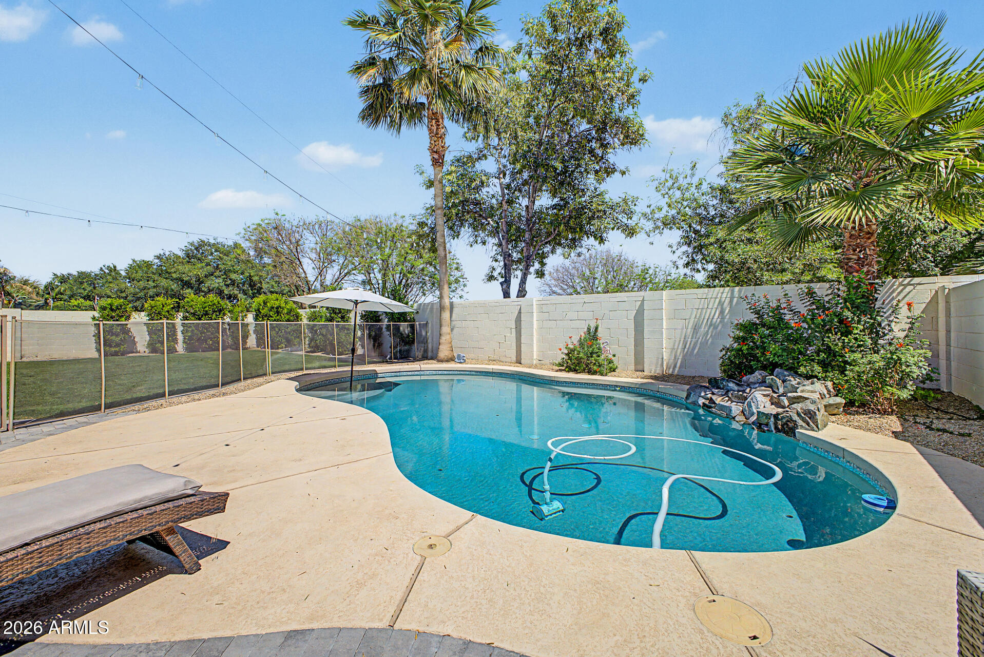 2065 South Porter Street Gilbert, AZ 85295 - Photo 32 of 36 a view of a swimming pool with a patio