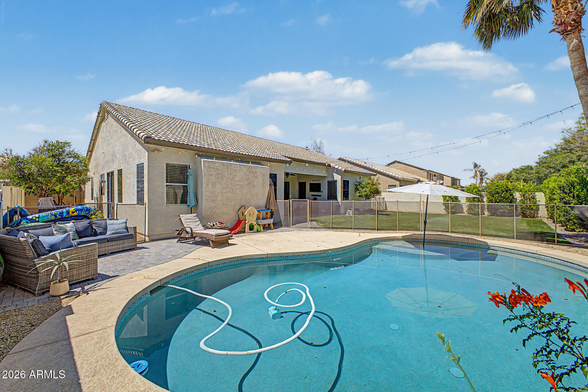 2065 South Porter Street Gilbert, AZ 85295 - Photo 33 of 36 a view of a house with swimming pool and sitting area