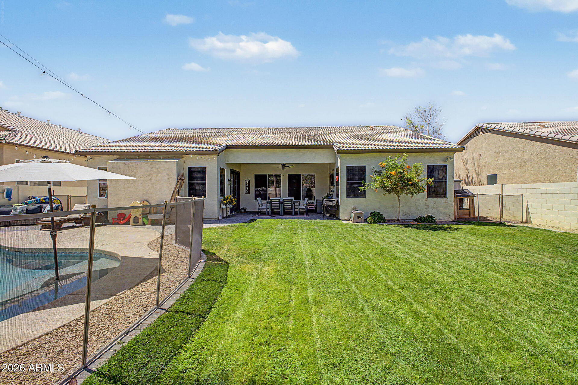 2065 South Porter Street Gilbert, AZ 85295 - Photo 34 of 36 a view of a house with a backyard porch and sitting area