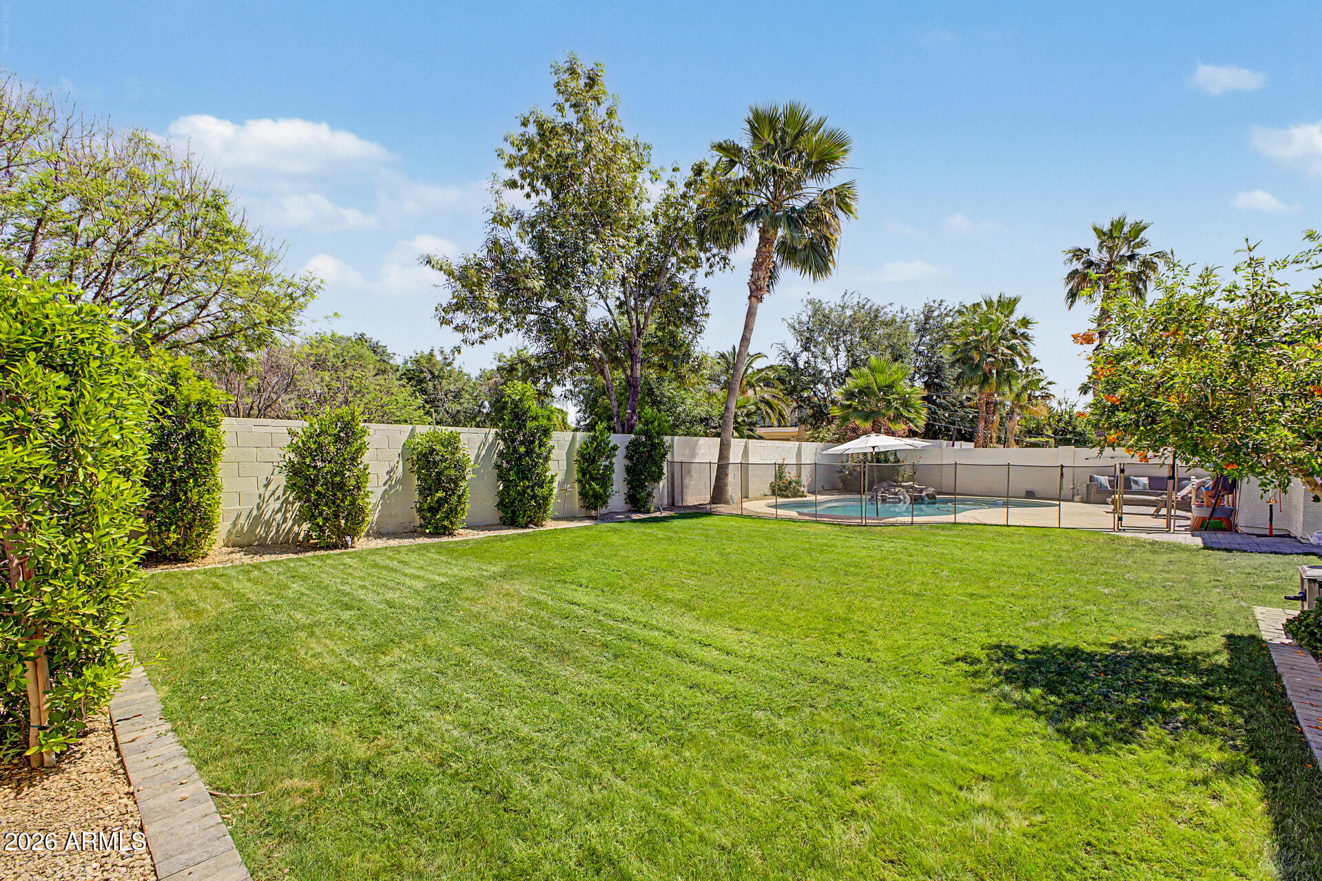 2065 South Porter Street Gilbert, AZ 85295 - Photo 36 of 36 a backyard of a house with table and chairs