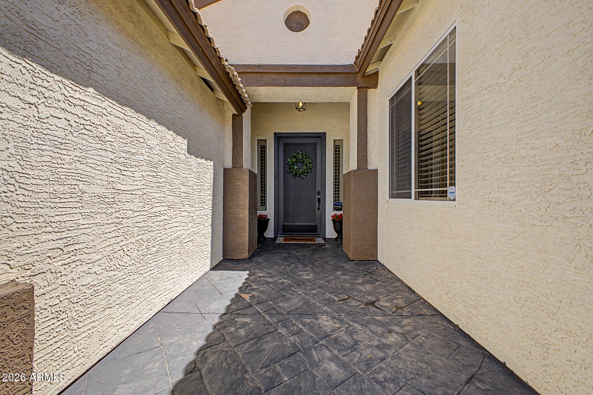 2065 South Porter Street Gilbert, AZ 85295 - Photo 4 of 36 a view of a hallway with wooden stairs