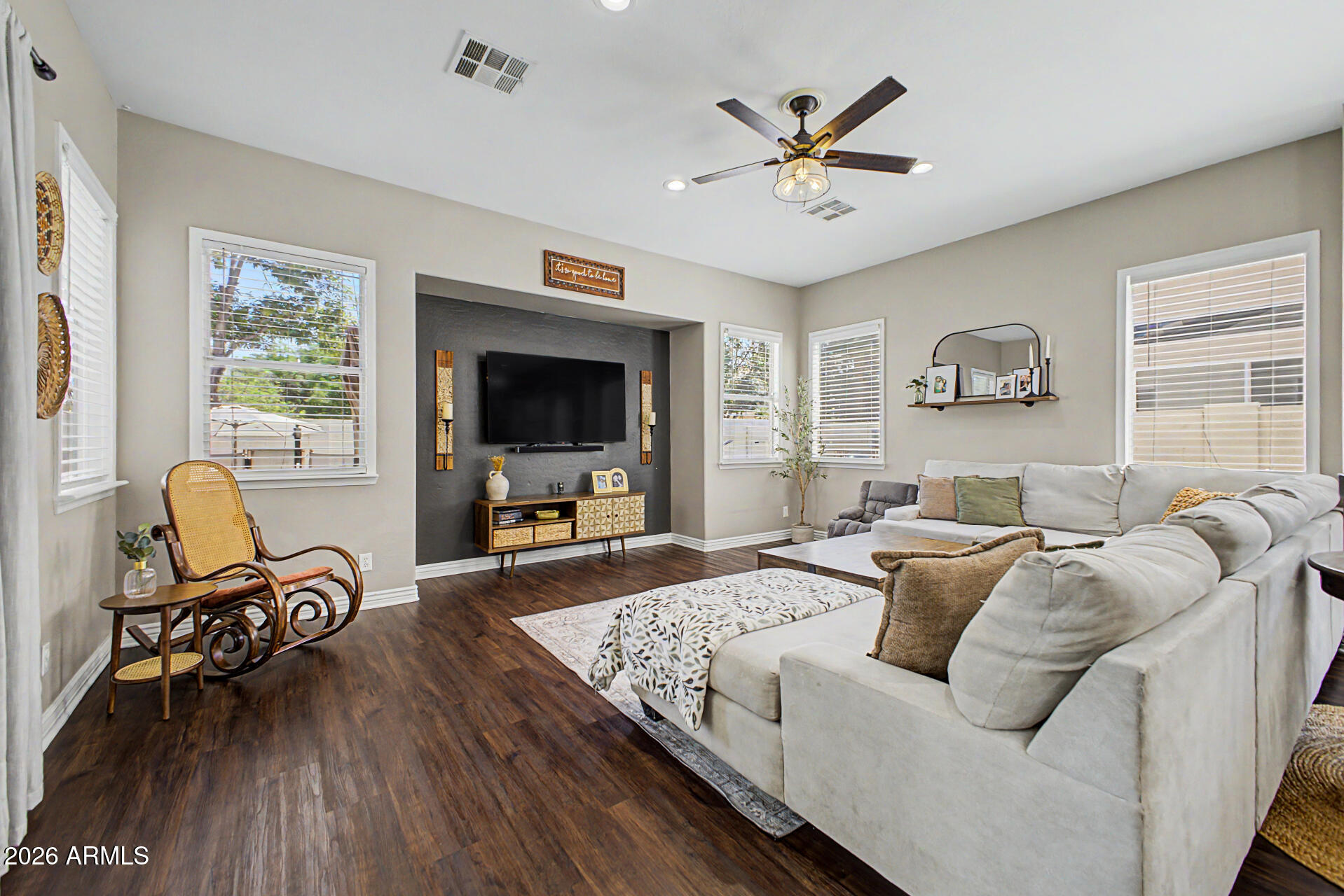 2065 South Porter Street Gilbert, AZ 85295 - Photo 6 of 36 a living room with furniture and a flat screen tv with wooden floor