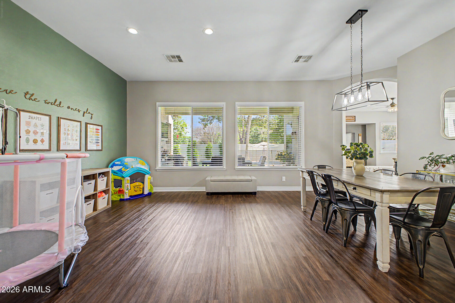 2065 South Porter Street Gilbert, AZ 85295 - Photo 10 of 36 a view of a dining room with furniture window and wooden floor