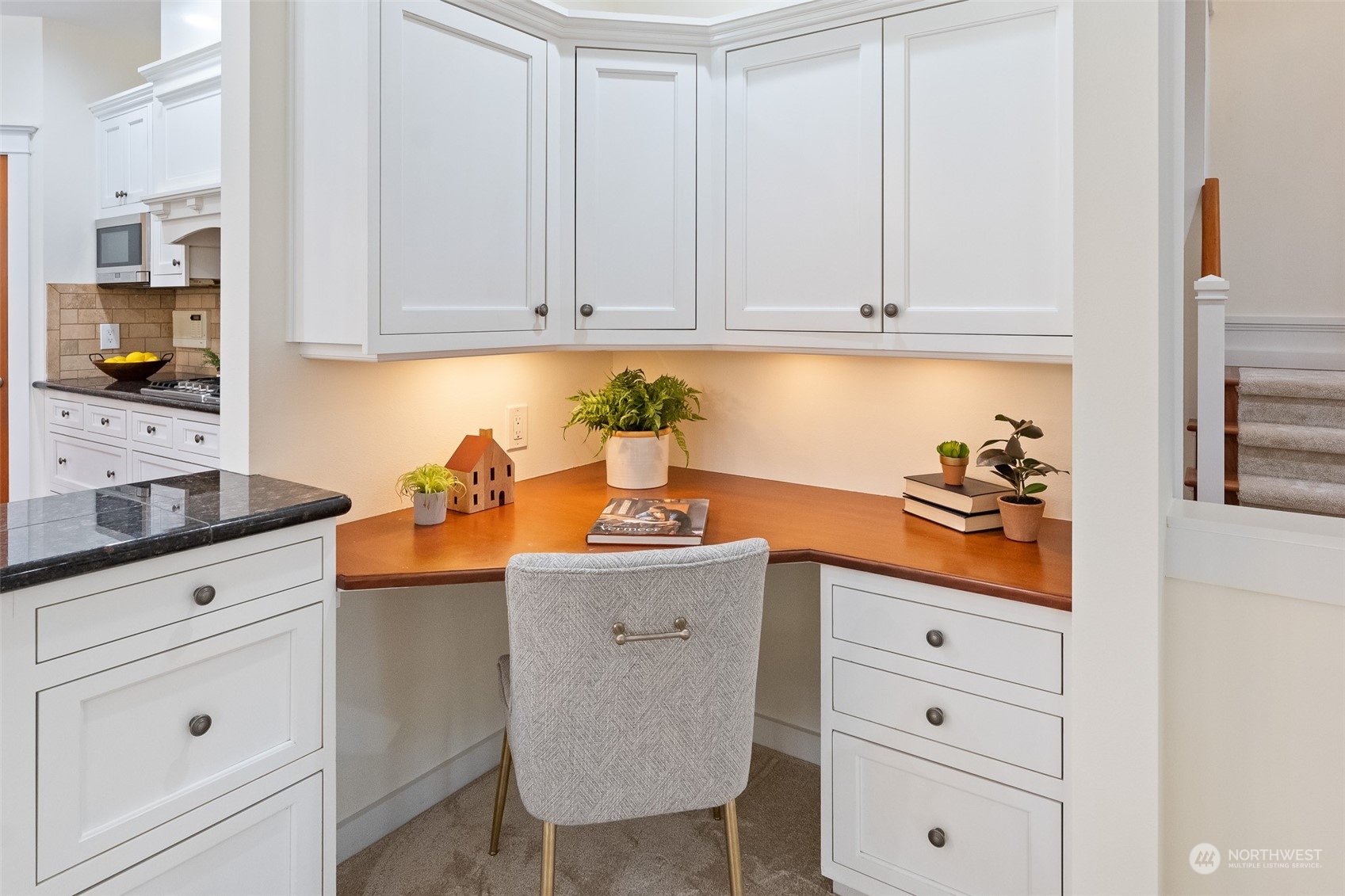 5119 Saddleback Road Northwest Gig Harbor, WA 98332 - Photo 11 of 40 a kitchen with white cabinets and sink