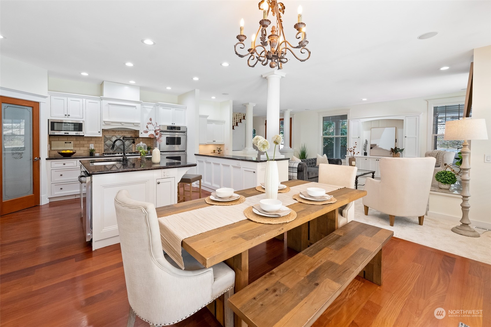 5119 Saddleback Road Northwest Gig Harbor, WA 98332 - Photo 15 of 40 a view of a dining room with furniture wooden floor and chandelier
