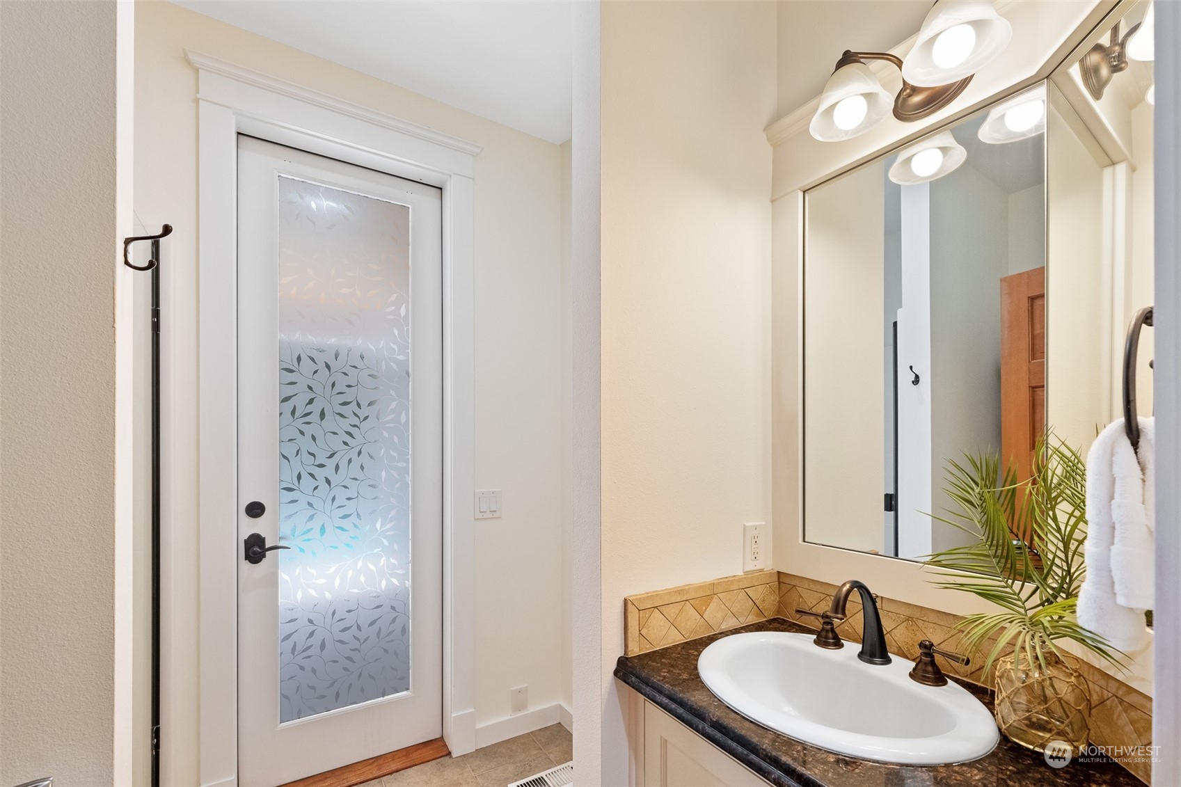 5119 Saddleback Road Northwest Gig Harbor, WA 98332 - Photo 17 of 40 a bathroom with a sink and a mirror