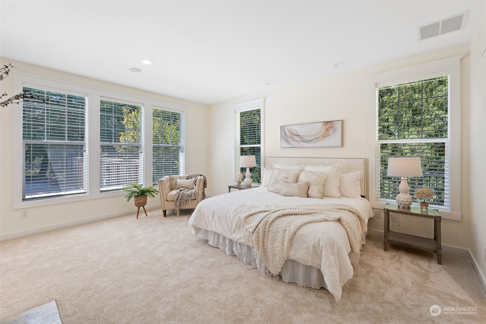 5119 Saddleback Road Northwest Gig Harbor, WA 98332 - Photo 18 of 40 a bedroom with a bed and a large window