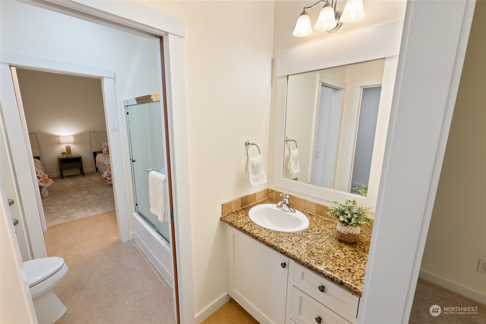 5119 Saddleback Road Northwest Gig Harbor, WA 98332 - Photo 24 of 40 a bathroom with a granite countertop sink and a mirror