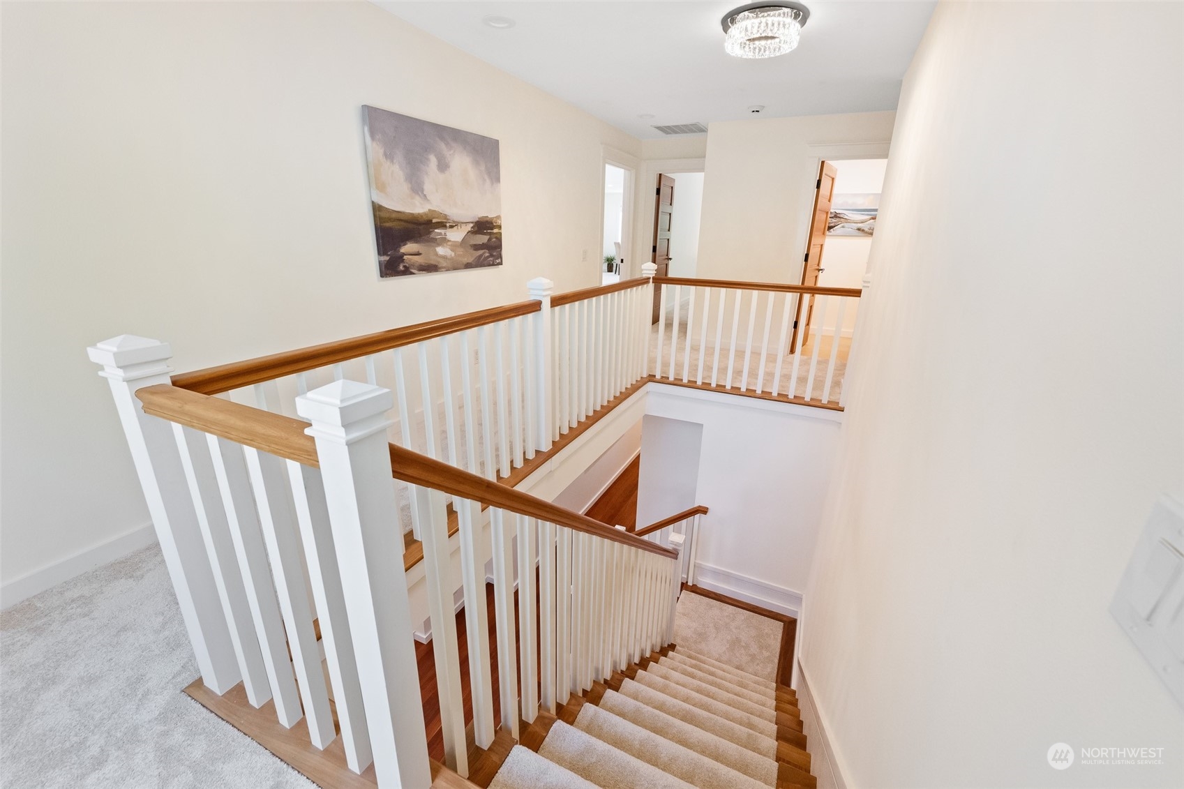 5119 Saddleback Road Northwest Gig Harbor, WA 98332 - Photo 27 of 40 a view of staircase with wooden floor and white walls