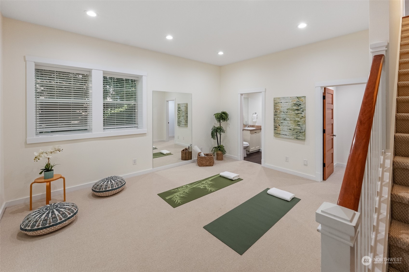 5119 Saddleback Road Northwest Gig Harbor, WA 98332 - Photo 32 of 40 a spacious bedroom with a bed and a large mirror