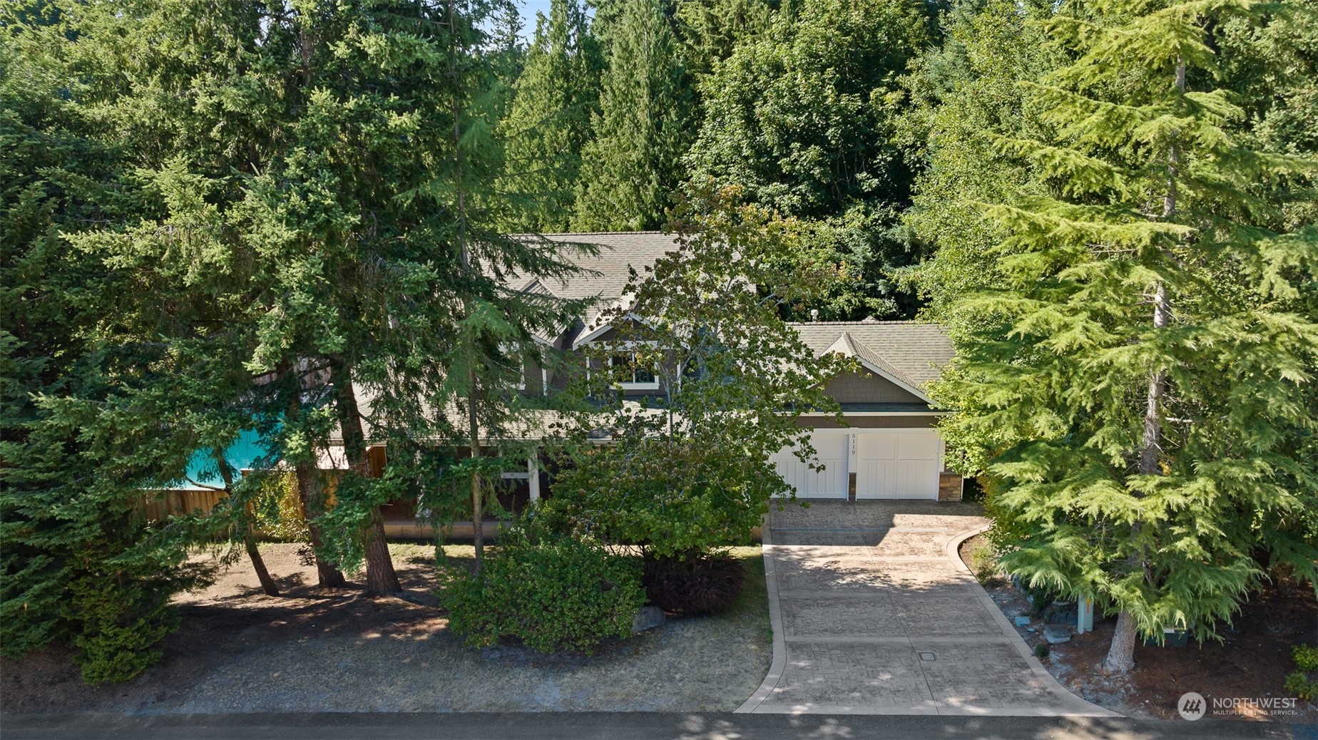 5119 Saddleback Road Northwest Gig Harbor, WA 98332 - Photo 39 of 40 a view of a house with a tree