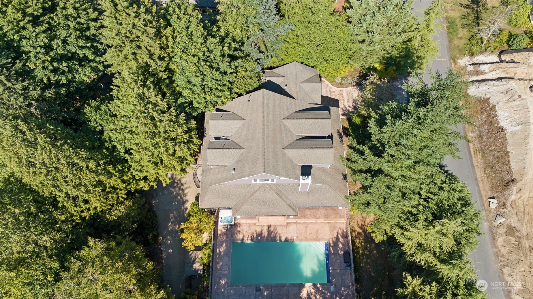 5119 Saddleback Road Northwest Gig Harbor, WA 98332 - Photo 40 of 40 an aerial view of a house with a yard and large trees