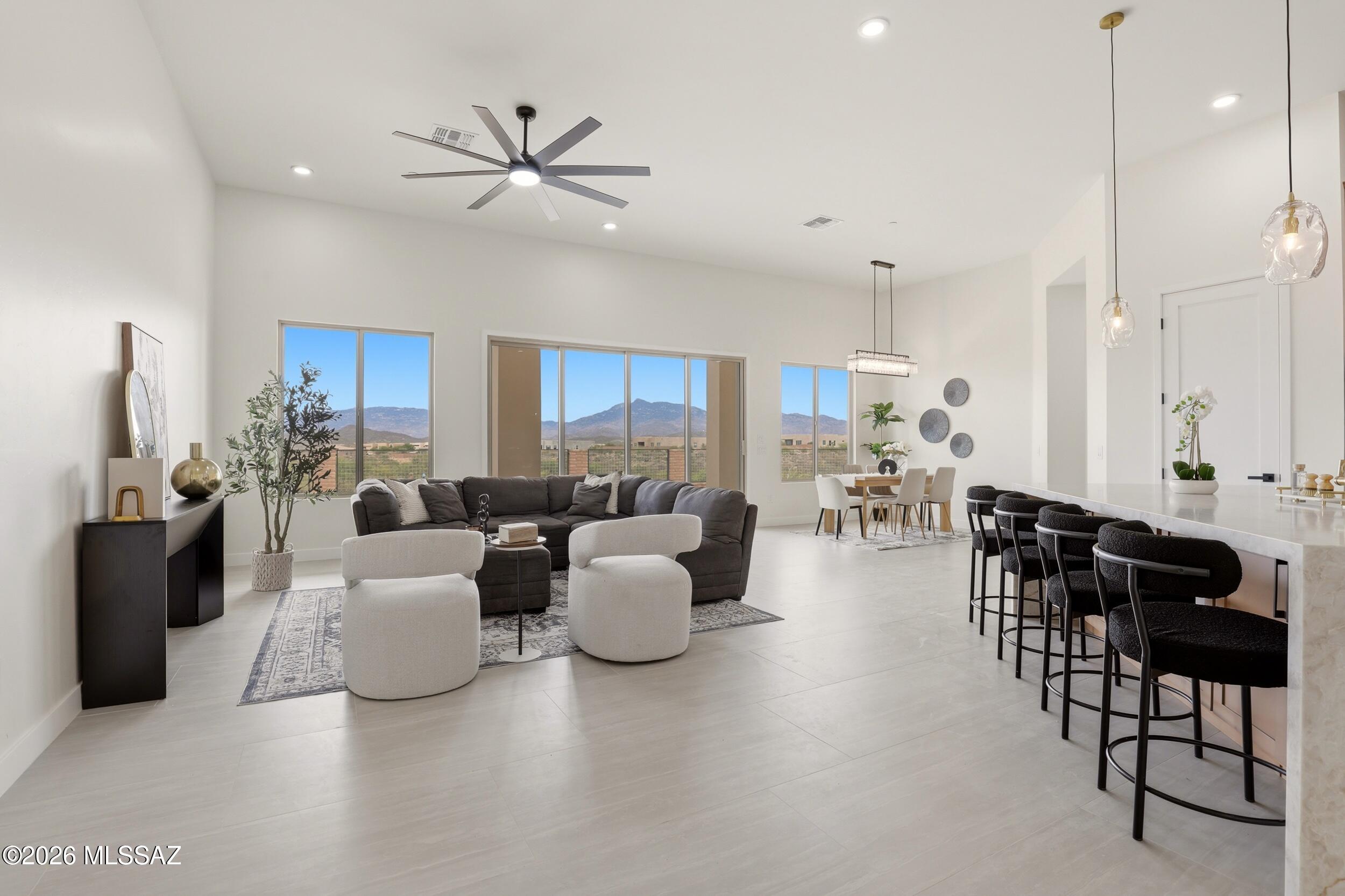 14527 East Sands Ranch Road Vail, AZ 85641 - Photo 16 of 48 a living room with furniture kitchen area and a chandelier
