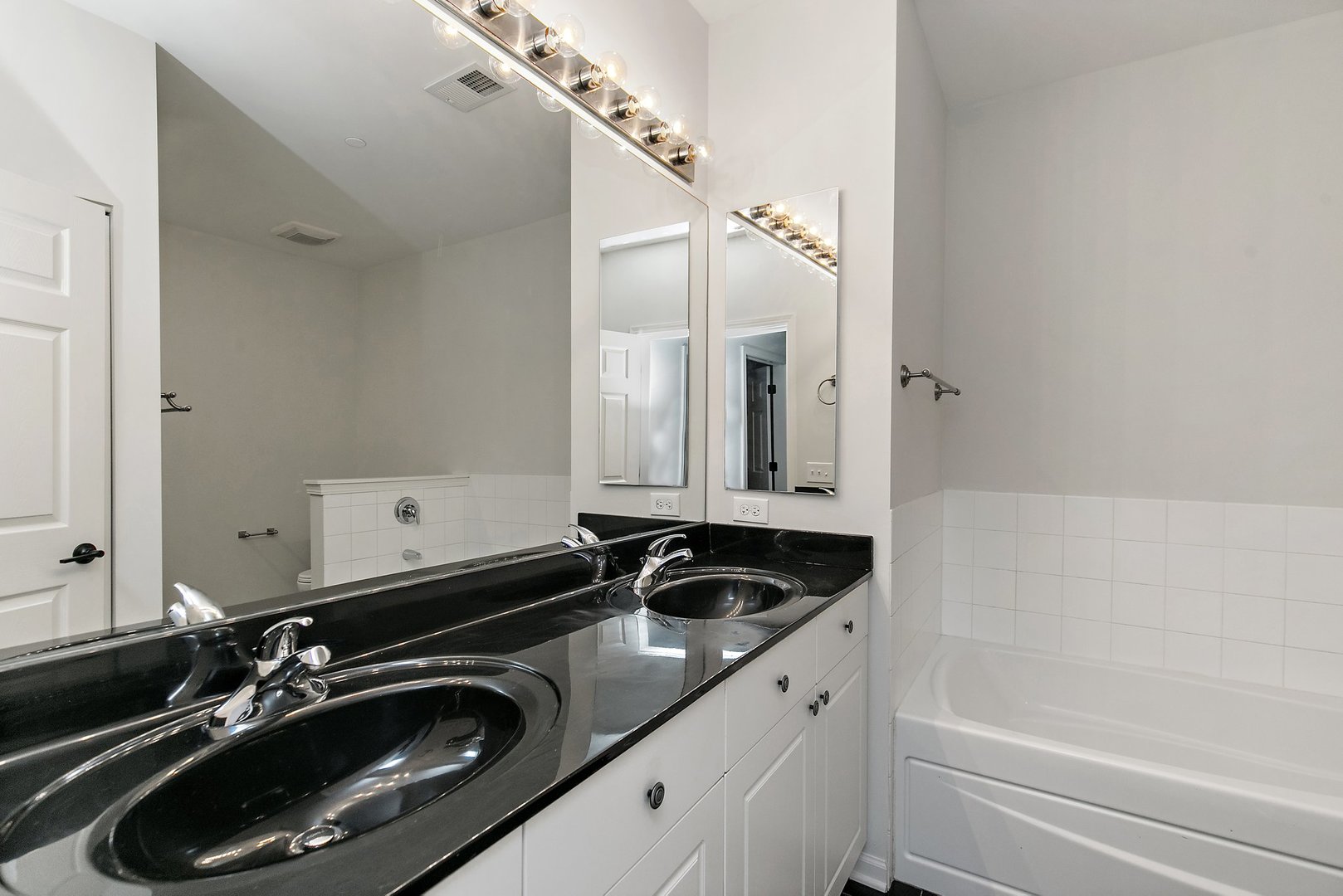 640 McHenry Road, Unit 303 Wheeling, IL 60090 - Photo 11 of 20 a bathroom with a sink and a mirror