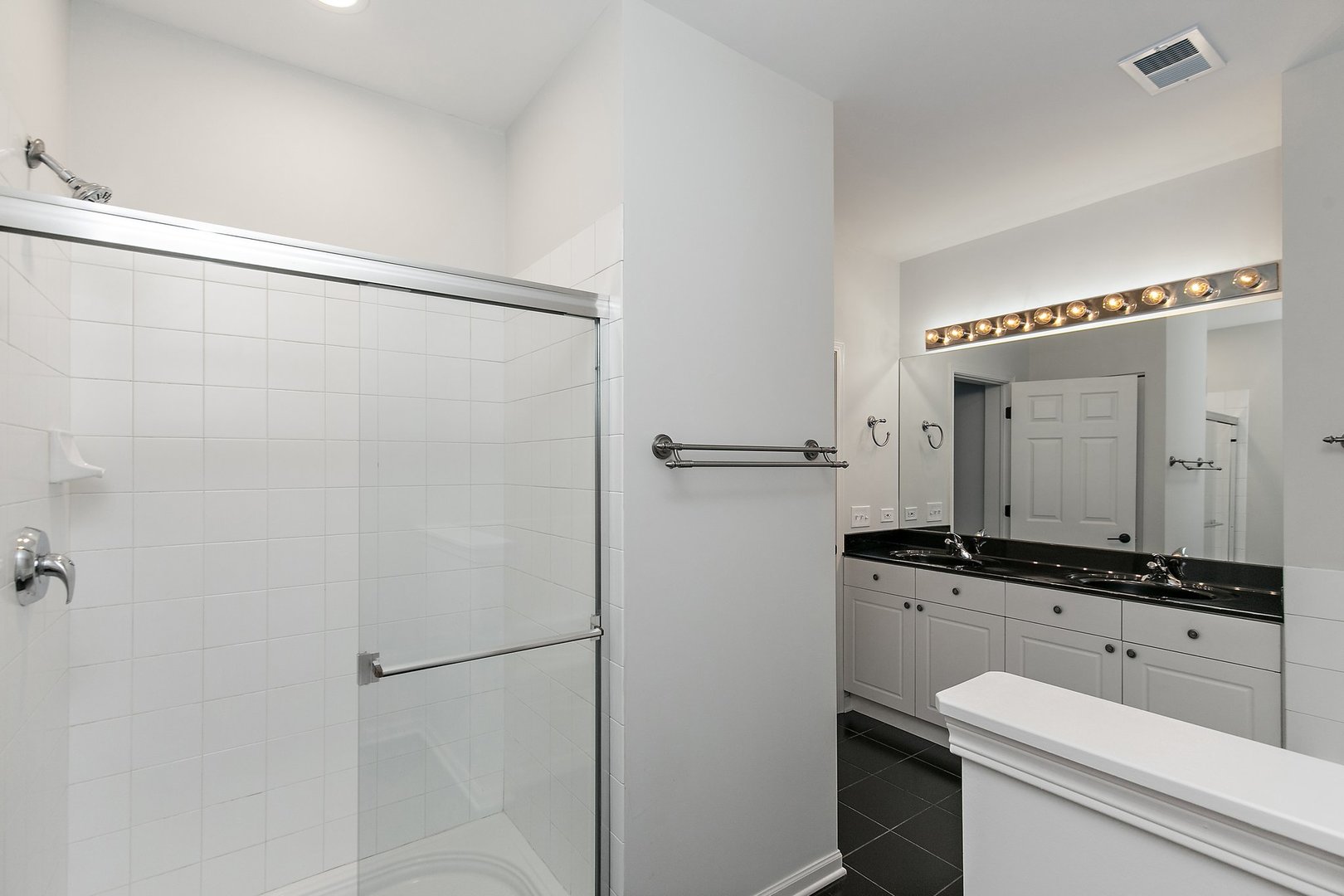 640 McHenry Road, Unit 303 Wheeling, IL 60090 - Photo 12 of 20 a bathroom with a granite countertop sink mirror vanity and toilet