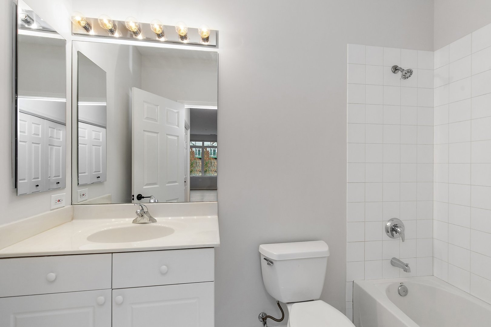 640 McHenry Road, Unit 303 Wheeling, IL 60090 - Photo 16 of 20 a bathroom with a sink toilet and shower