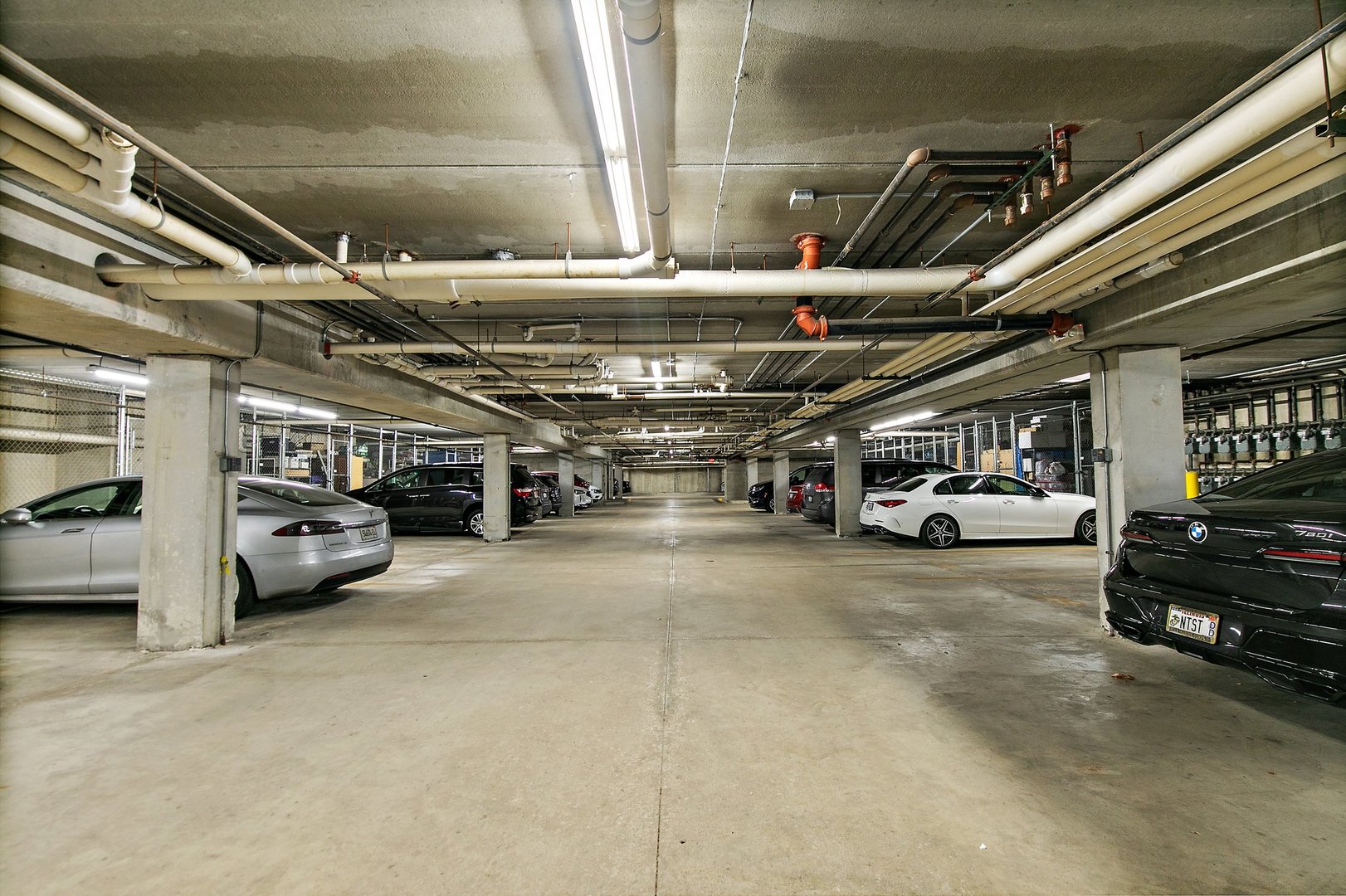 640 McHenry Road, Unit 303 Wheeling, IL 60090 - Photo 19 of 20 a view of parking garage with cars