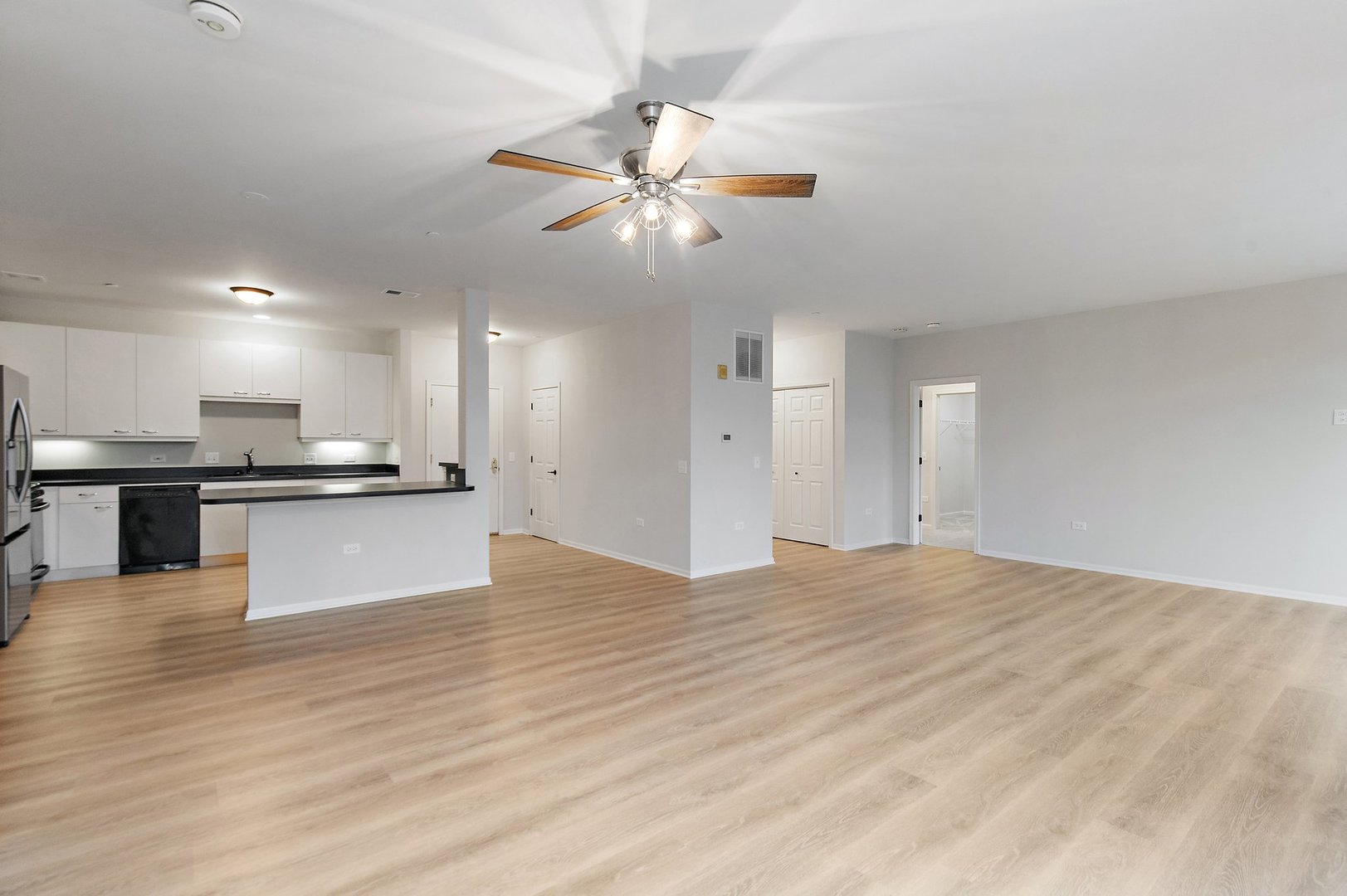 640 McHenry Road, Unit 303 Wheeling, IL 60090 - Photo 5 of 20 a view of an empty room and kitchen view