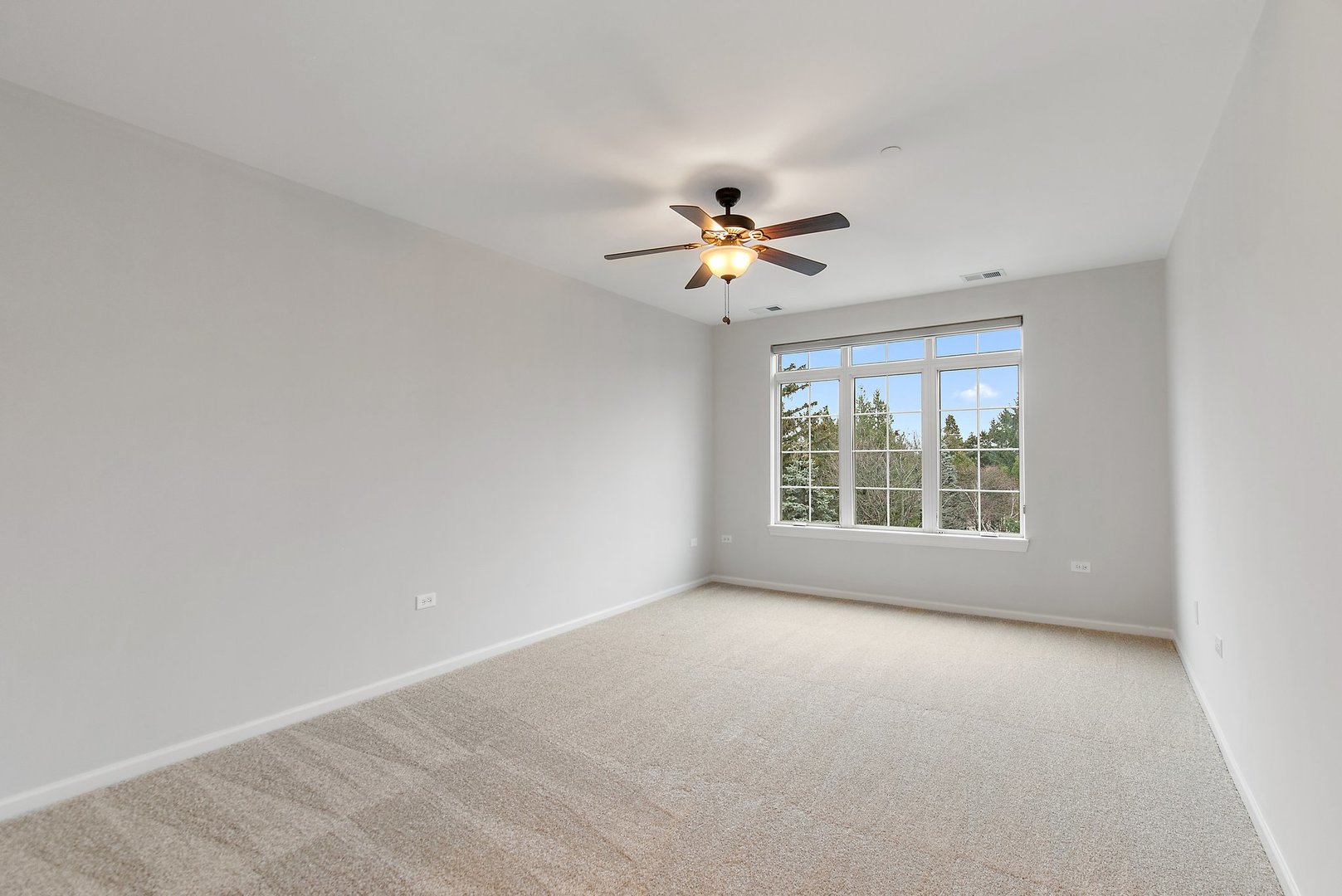 640 McHenry Road, Unit 303 Wheeling, IL 60090 - Photo 8 of 20 a view of an empty room with a window