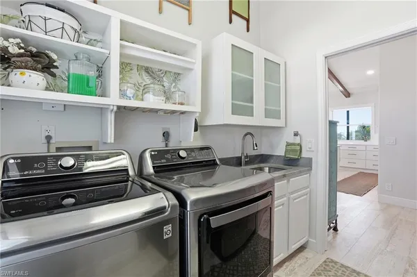 a kitchen with stainless steel appliances granite countertop a stove and a sink