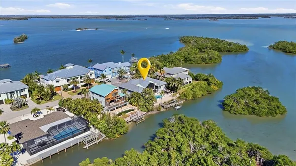 an aerial view of a house with a yard swimming pool