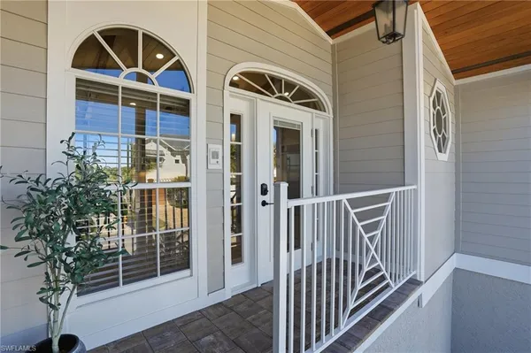 a view of front door and potted plants