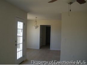 152 Swain Street Spring Lake, NC 28390 - Photo 7 of 12 a view of an empty room with a window