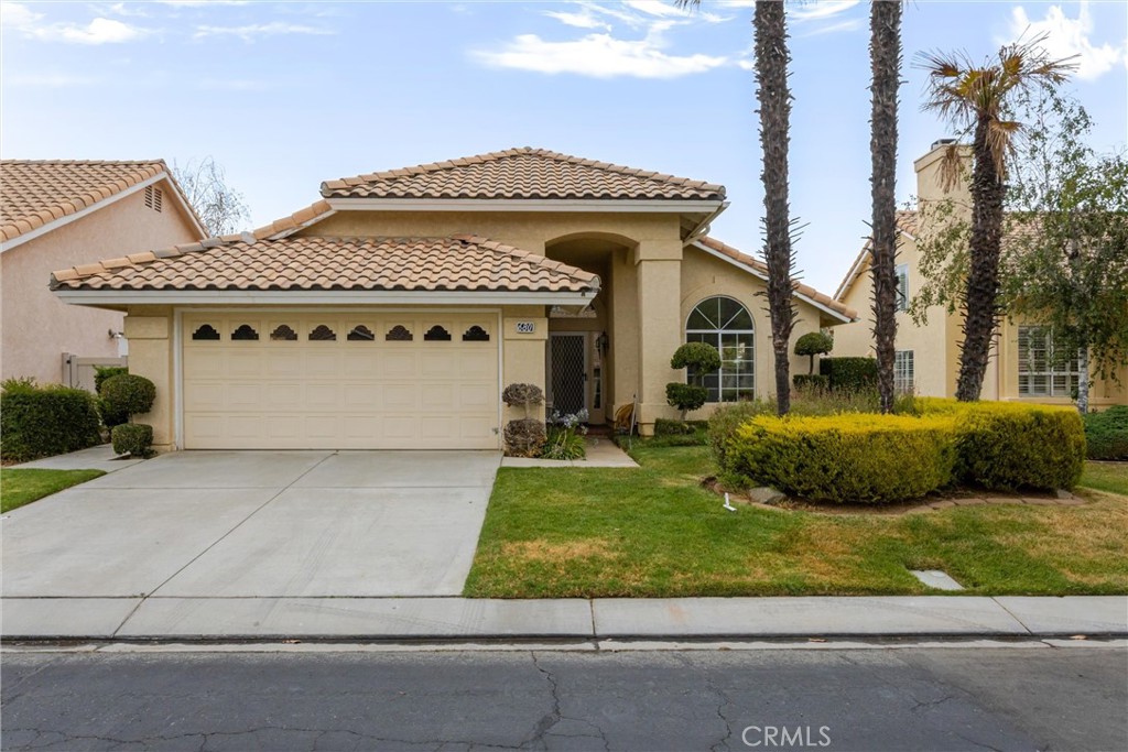 680 Indian Wells Road Banning, CA 92220 - Photo 2 of 37 a front view of a house with garden