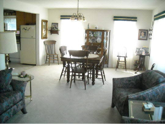 14015 South Bluff Road Rockton, IL 61072 - Photo 3 of 11 a view of a dining room with furniture and a chandelier