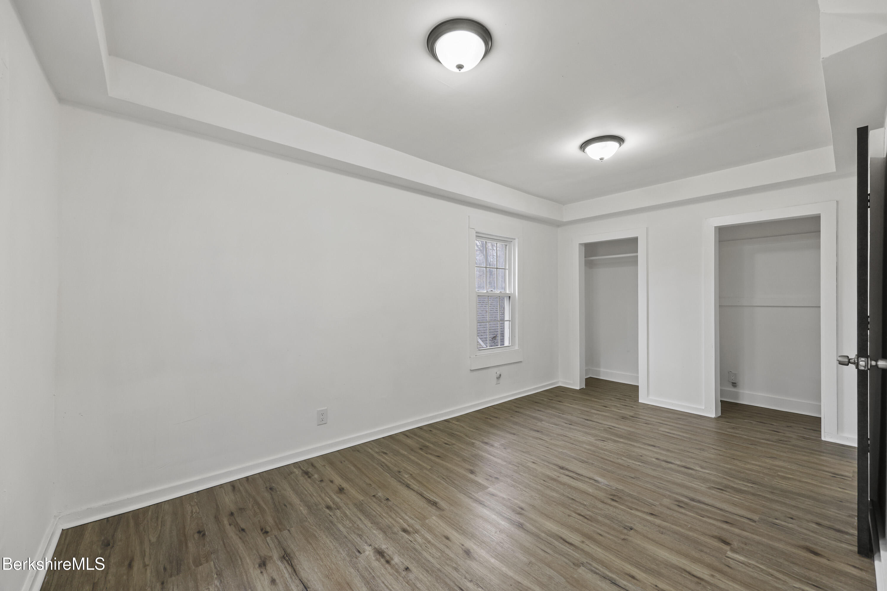41 Prospect Street North Adams, MA 01247 - Photo 15 of 34 a view of an empty room with wooden floor and a window