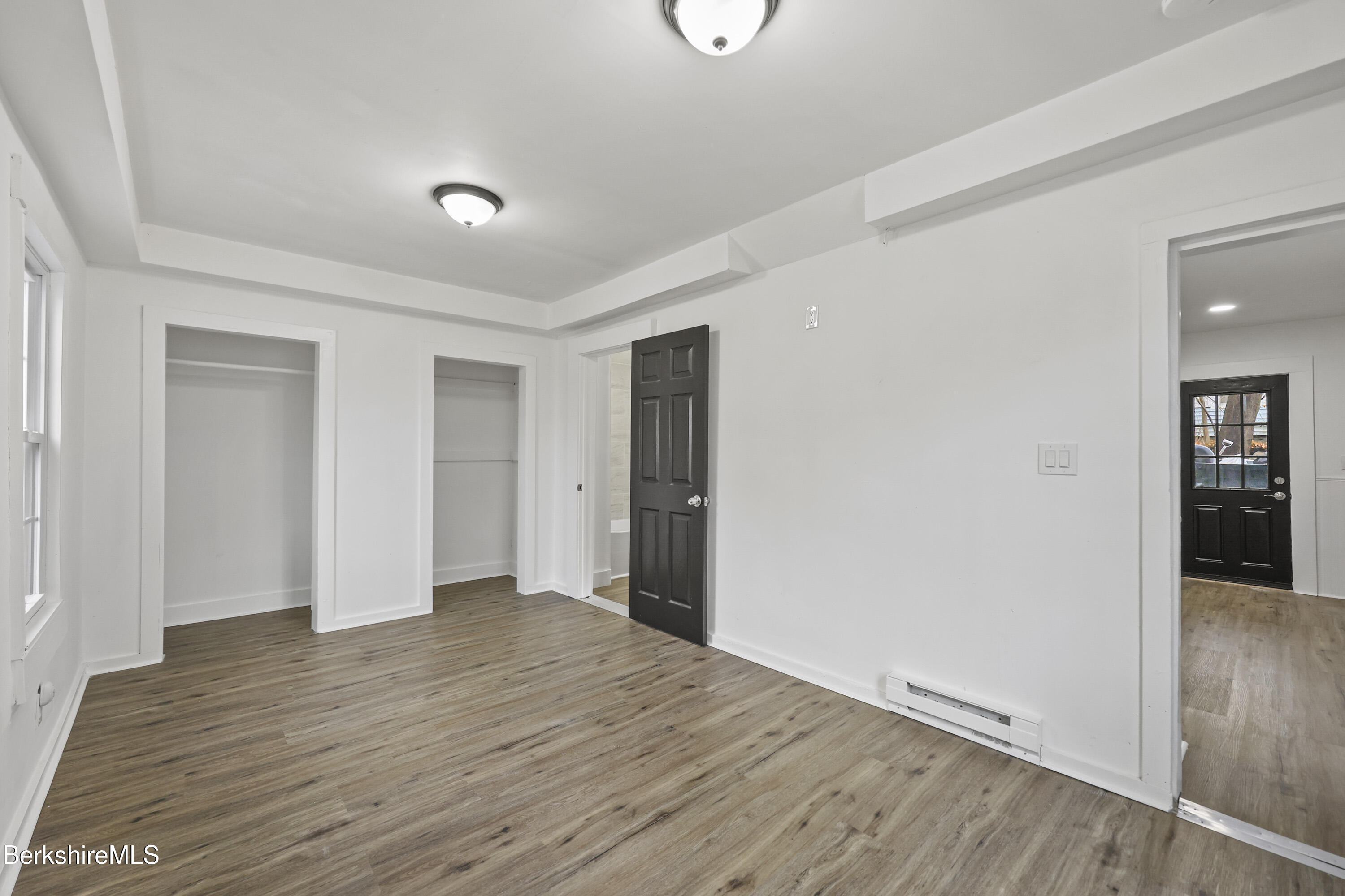 41 Prospect Street North Adams, MA 01247 - Photo 16 of 34 wooden floor in an empty room with a window
