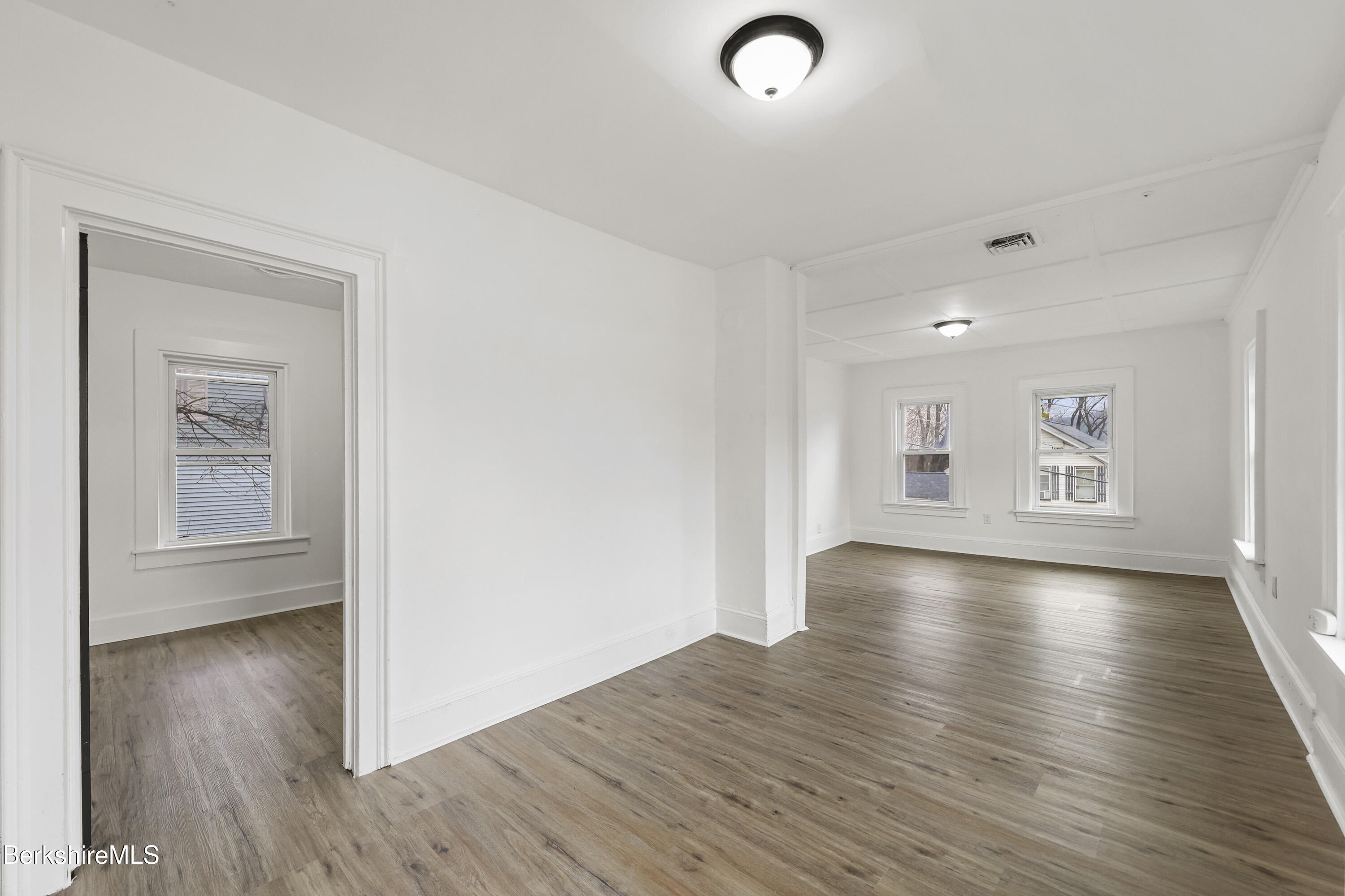 41 Prospect Street North Adams, MA 01247 - Photo 24 of 34 an empty room with wooden floor and windows